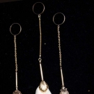 THREE GOLD HANDKERCHIEF HOLDERS, 1850-1870
