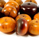 ANTIQUE EGG YOLK AMBER BEADS, CHINA or TIBET