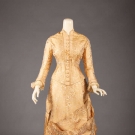 GOLD BROCADE BUSTLE DRESS, 1870s