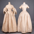 TWO CREAM SILK WEDDING GOWNS, 1850s