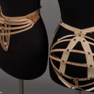 TWO COLLAPSIBLE BUSTLES, 1880s