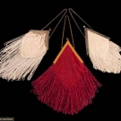 THREE DIAMOND SHAPED FRINGED BAGS, 1910-1930s