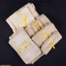 FOUR SETS OF FINE TABLE LINENS, 1900-1920