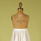 CHILD'S WHITE EYELET APRON, EARLY 20th C