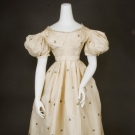 CREAM SILK BROCADE BALLGOWN, LATE 1820s
