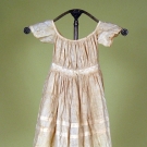 SMALL CHILD'S WHITE LINEN DRESS, MID 19th C