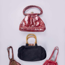 COLLECTION OF LEATHER &amp; SILK HANDBAGS, USA, 1940s-1950s
